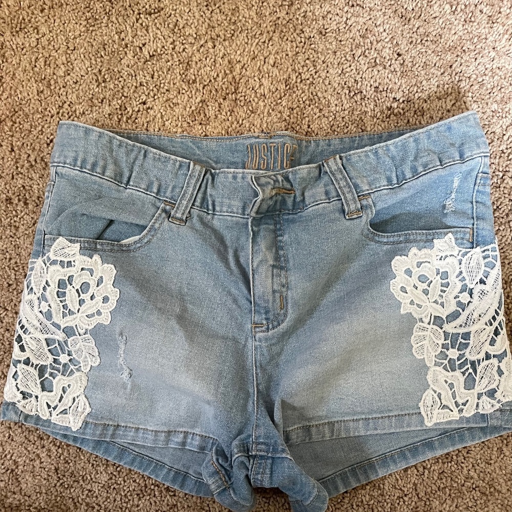 Justice blue jean shorts with floral stitching